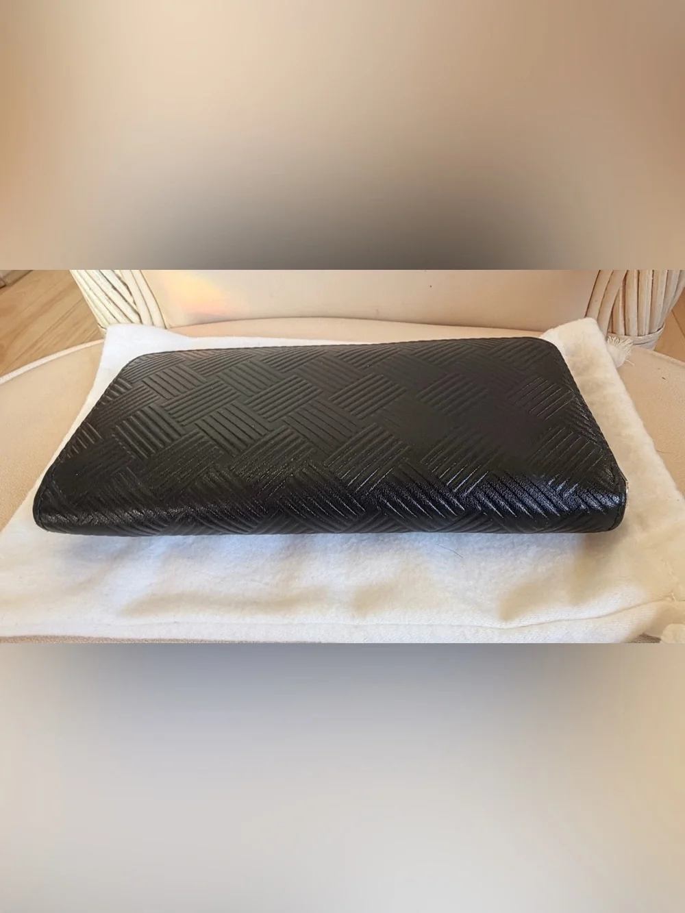 BOTTEGA VENETA Black Zip Around Wallet in Intrecciato Debossed Calfskin. UNISEX.